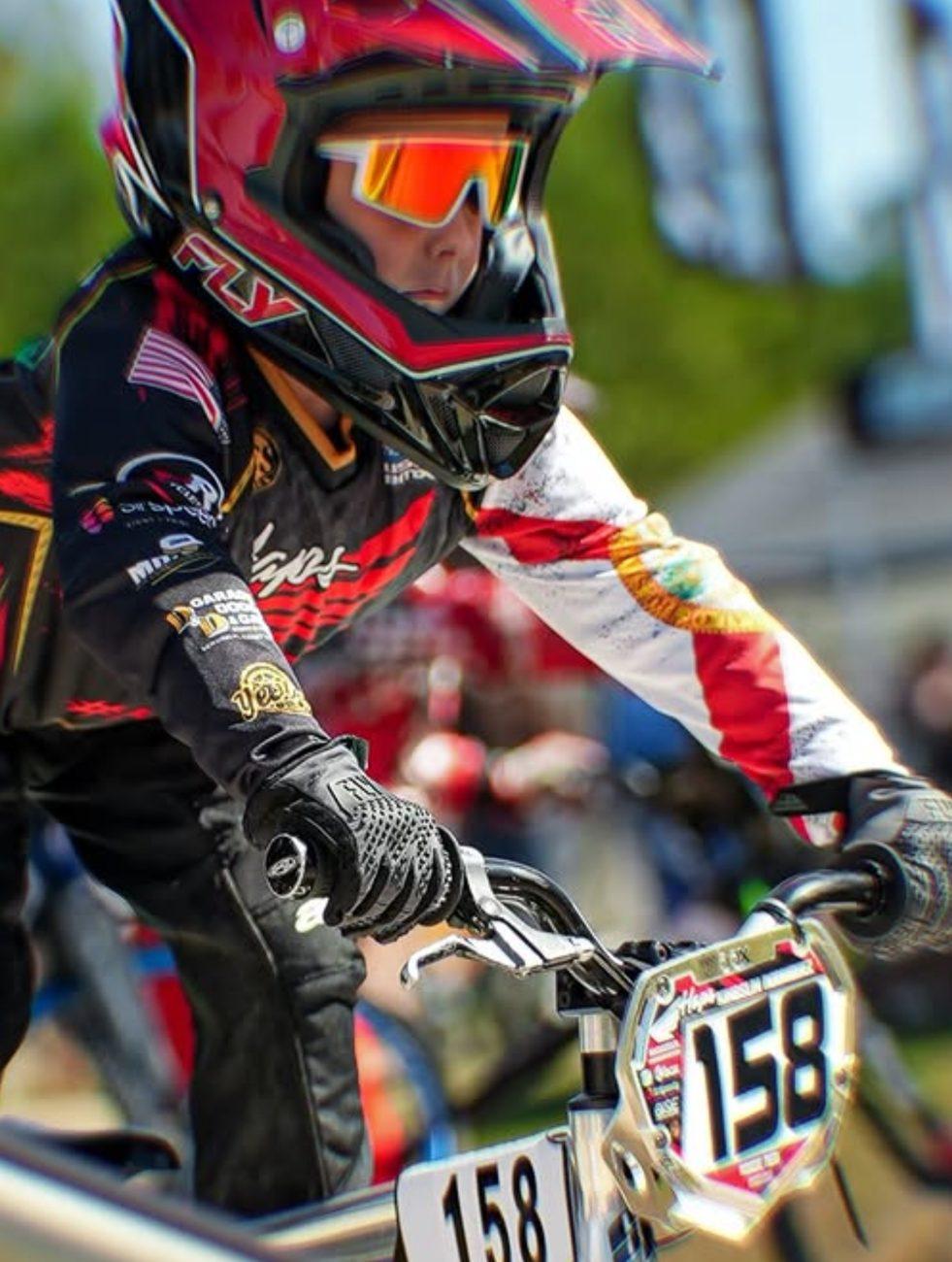 Rider on the gate with number plate 158