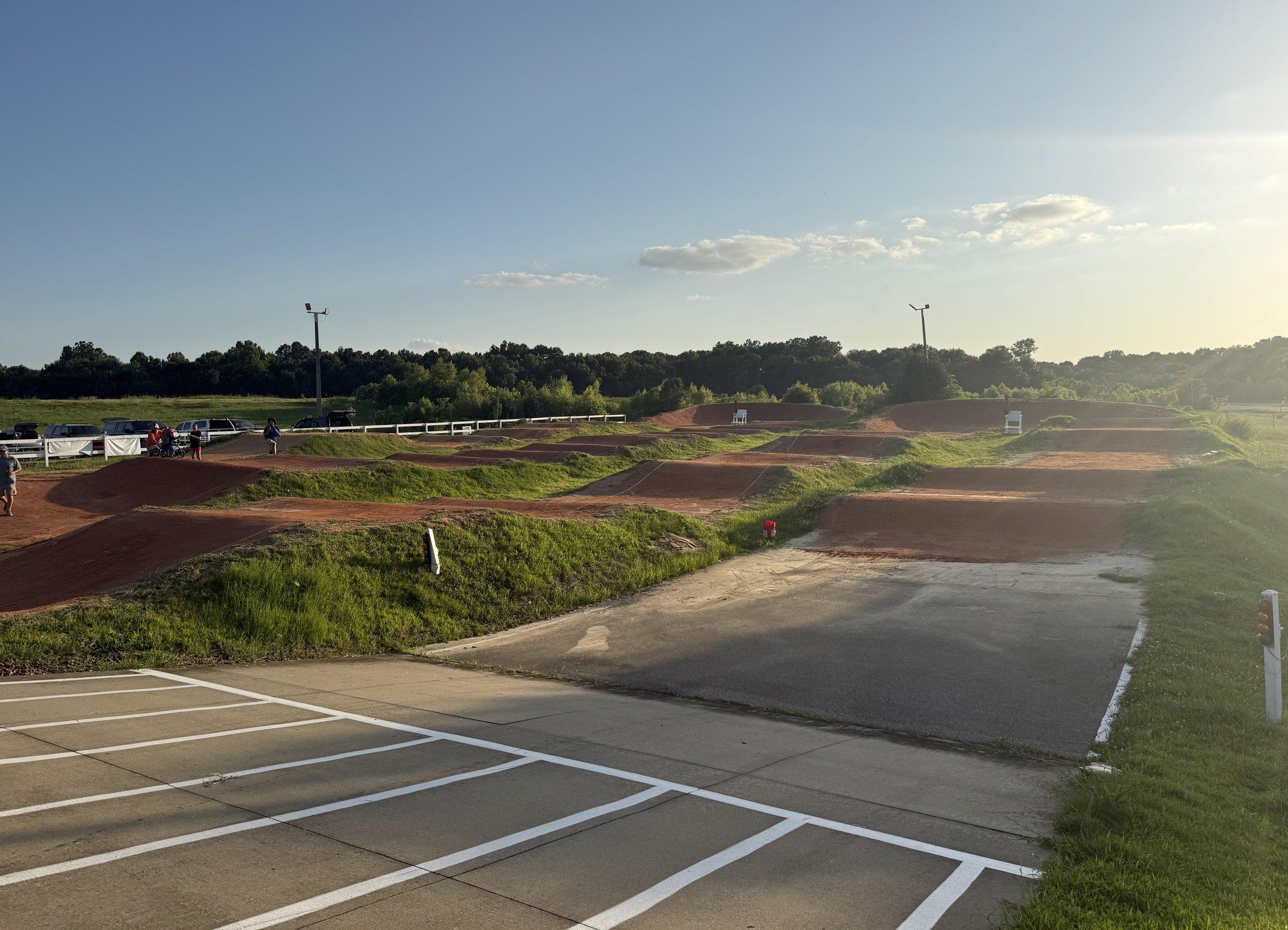 The track from the parking lot, straights and berms under the lights